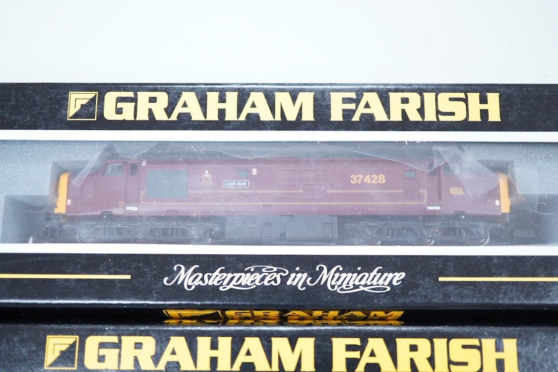 Three boxed Graham Farish N gauge railway Class 37/4 Co-Co diesel-electric locomotives; a Scottish EWS, Loch Awe (371151), a Regional Railways, Eisteddfod Genedlaethol 37429 (371154), and an EWS, 37419 (371153).